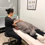 Sports therapist treating a client in London