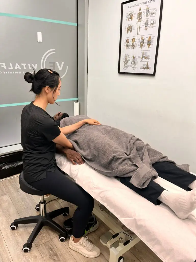 Sports therapist treating a client in London